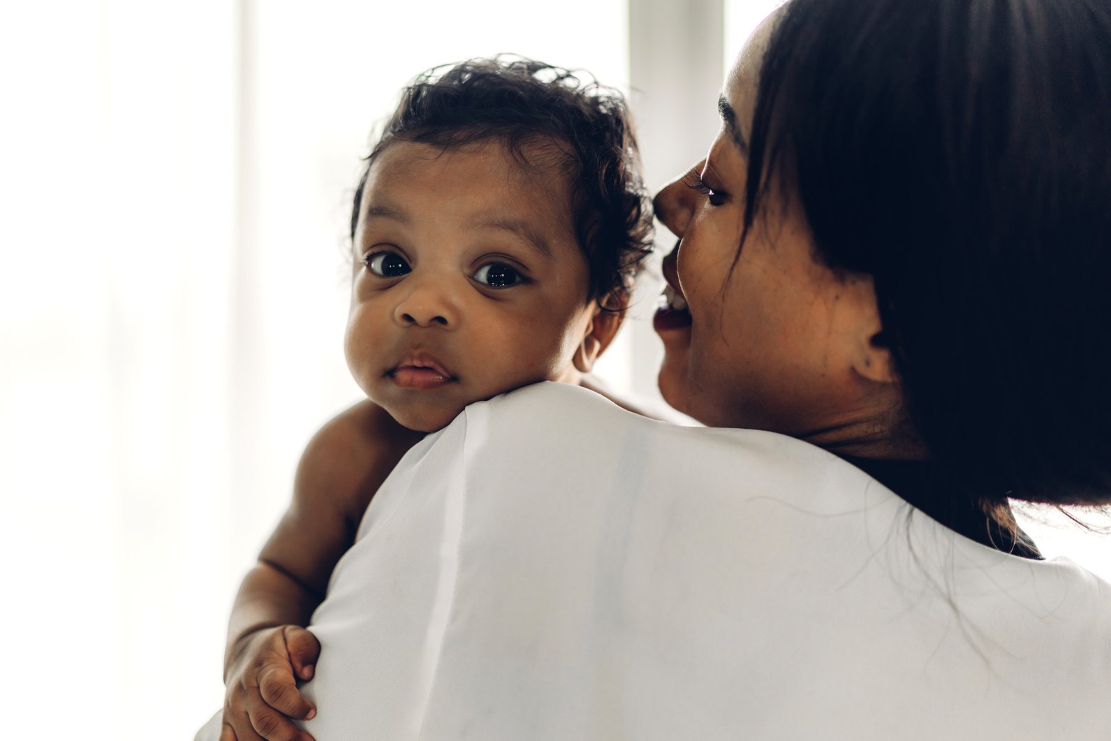 African American Mother Holding Adorable Little African American