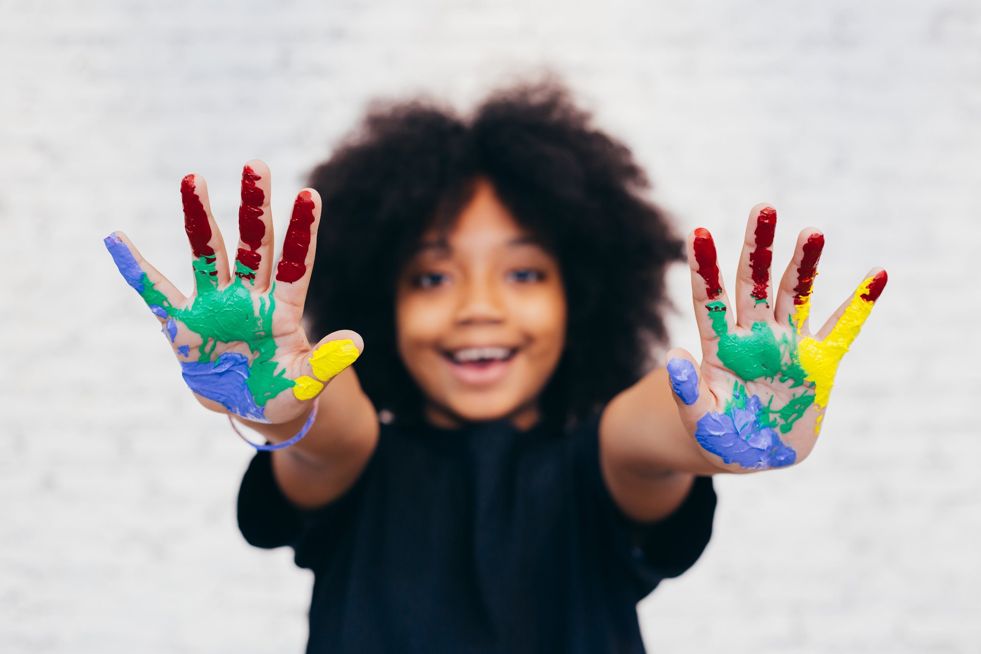 African American Playful and Creative Kid Getting Hands Dirty Wi